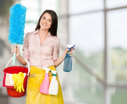 Technician treating high-traffic carpet areas during commercial carpet cleaning